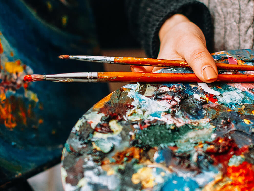 Person holding paints